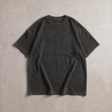 Cotton Collective Vintage Black 6.0 oz Tour S/S Tee, styled flat lay