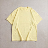 Cotton Collective Vintage Ivory 6.0 oz Tour S/S Tee, styled flat lay