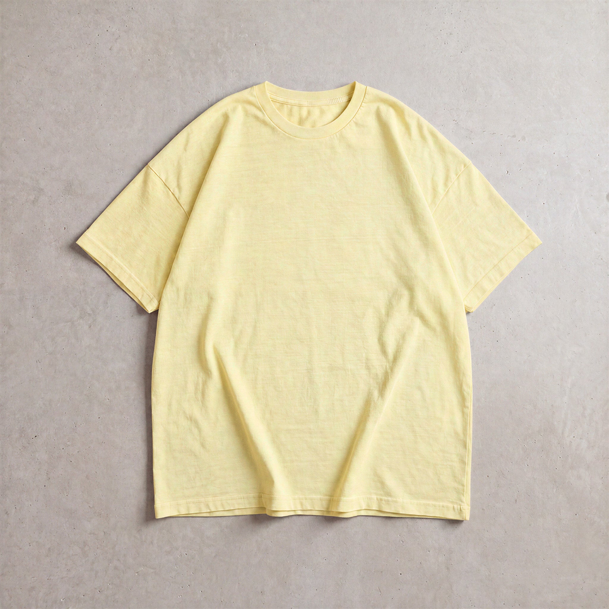 Cotton Collective Vintage Ivory 6.0 oz Tour S/S Tee, styled flat lay