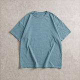 Cotton Collective Vintage Jean Blue 6.0 oz Tour S/S Tee, styled flat lay