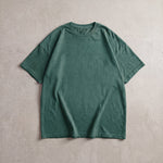 Cotton Collective Vintage Spruce Green 6.0 oz Tour S/S Tee, styled flat lay
