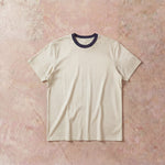 Cotton Collective Ringer Cream Navy Oversized Box S/S Tee 7.5oz, laid flat on concrete