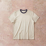 Cotton Collective Ringer Cream Navy Oversized Box S/S Tee 7.5oz, laid flat on concrete