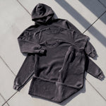 Cotton Collective Vintage Black Special Crew 14oz, laid flat on concrete
