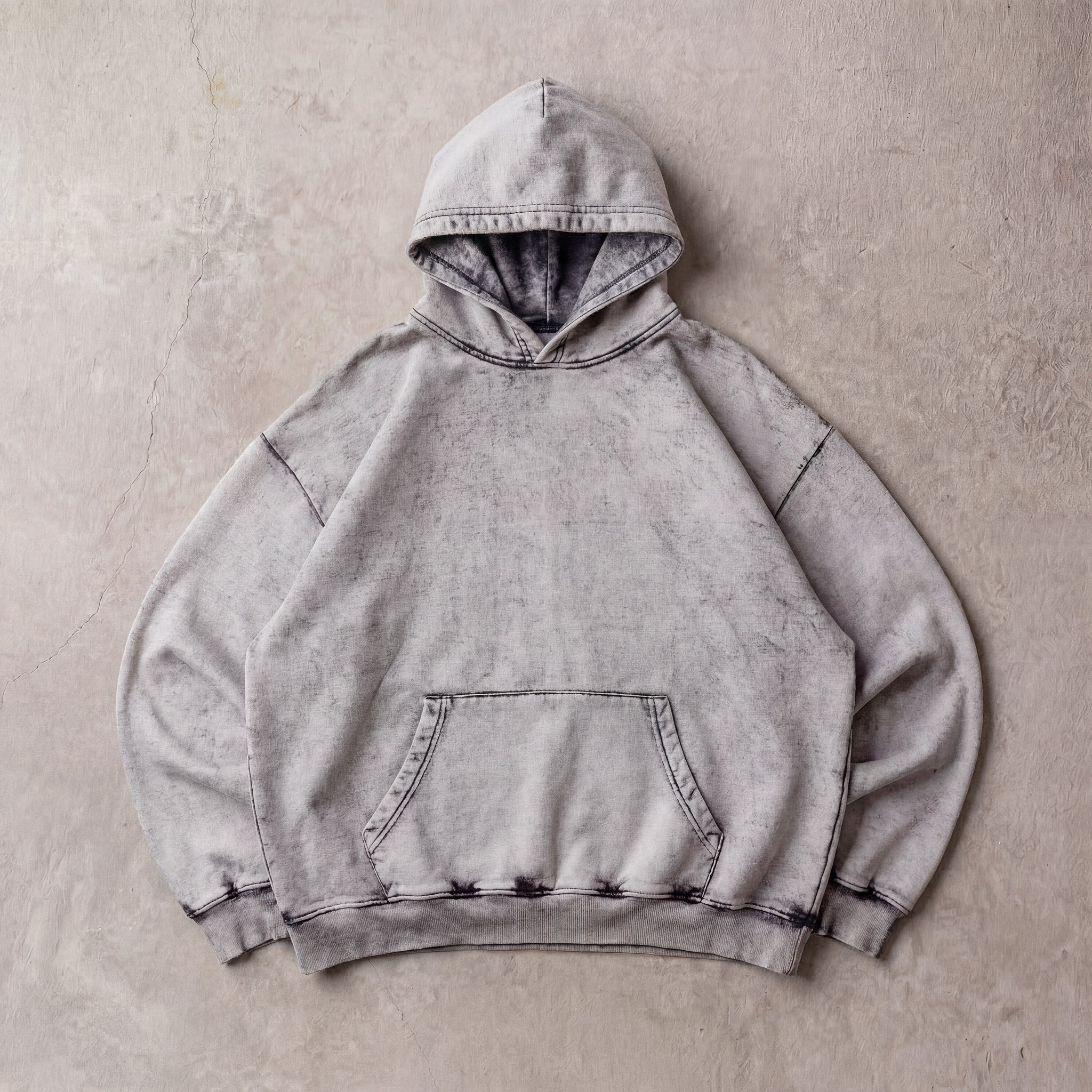 Cotton Collective Cement Special Hoodie 14oz, laid flat on concrete