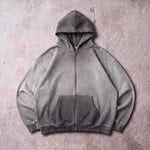 Cotton Collective Charcoal Oil Wash Special Zip Hoodie 14oz, laid flat on concrete